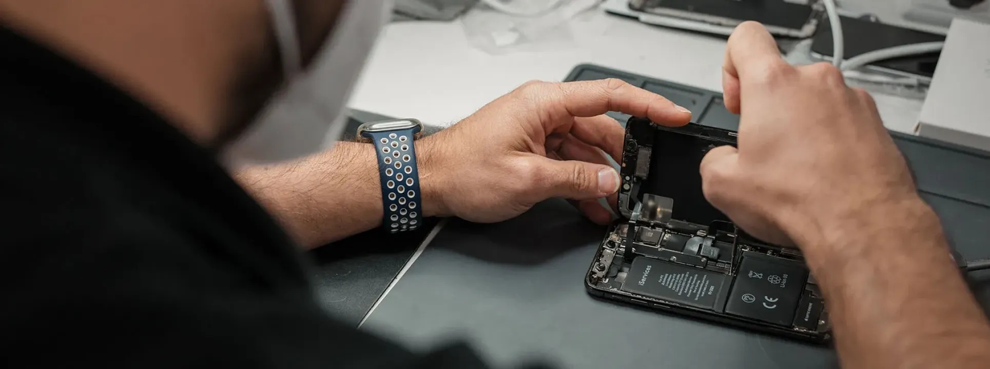 How are cell phone repairs carried out at iServices?